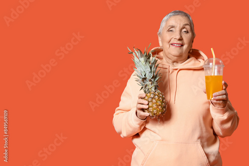 Senior woman with juice and...