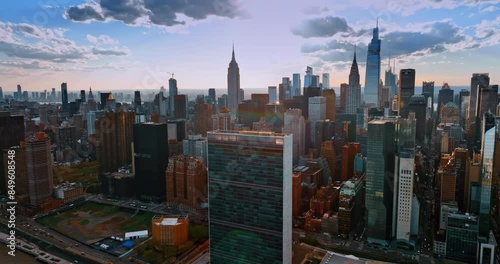 Densely built downtown of modern New York at sunset. Beautiful urban architecture from drone footage.