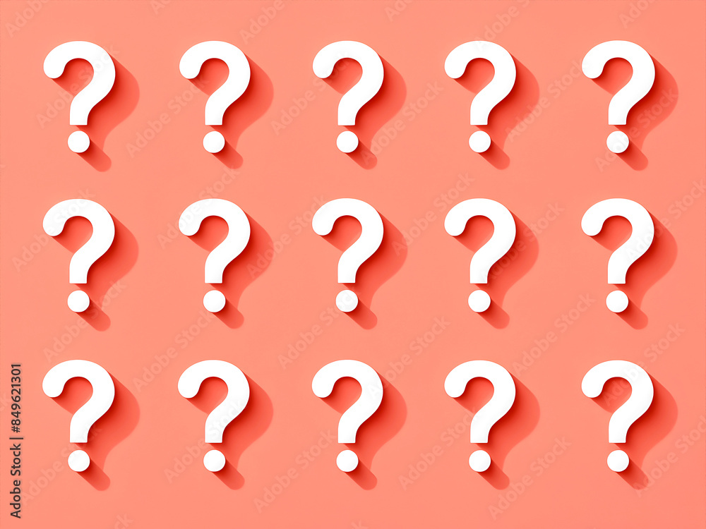 A set of white question marks on an isolated pastel coral background A set of white question marks on an isolated pastel coral background