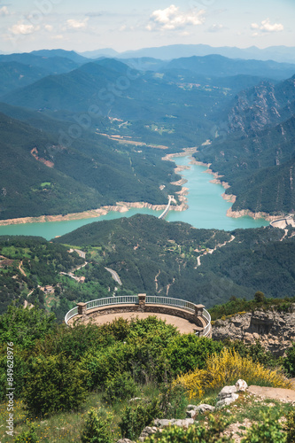 Panoramic view of the Mirador de la Figuerassa, Berguedà, Catalonia, Spain. Baells reservoir, Catllaras and Picacel mountains. City of Berga in the middle of a forest. Barcelona province, Cercs. photo