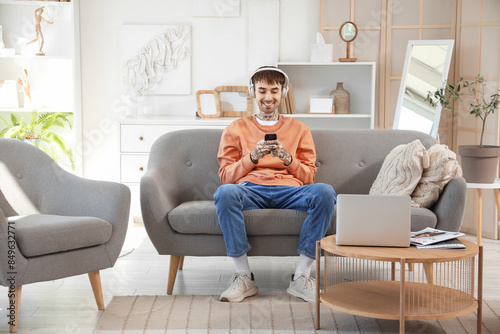 Young man with headphones a...