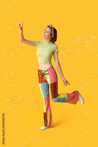 Teenage girl with soap bubb...