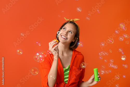 Happy teenage girl blowing ...