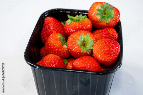 New spring harvest, one box of ripe Dutch red sweet strawberry on farmer market in the Netherlands