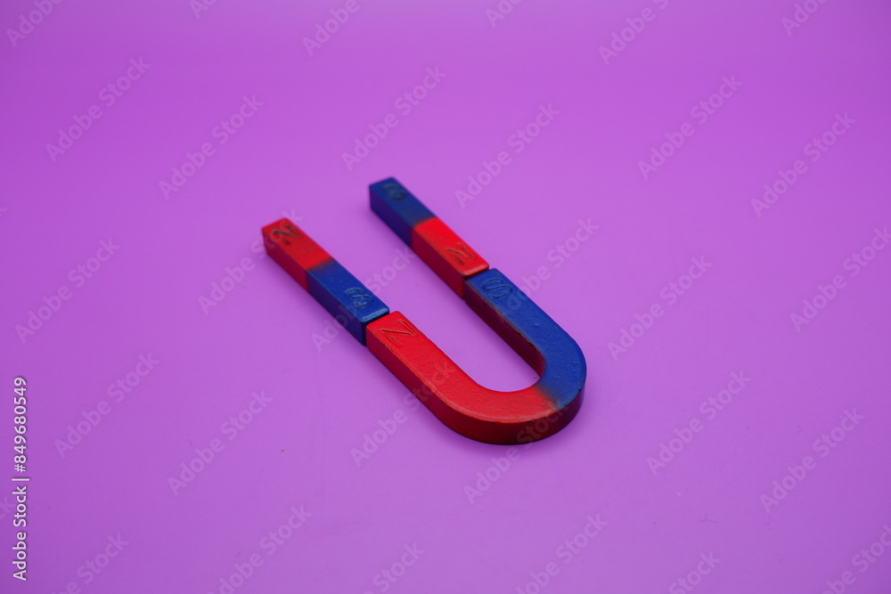 horseshoe magnets and bar magnets isolated on a purple background horseshoe magnets and bar magnets isolated on a purple background