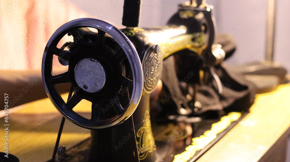 Fototapeta premium Vintage Sewing Machine in Use with Close-Up Details