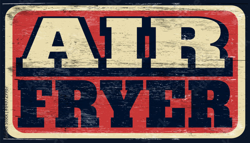 Aged and worn air fryer sign on wood