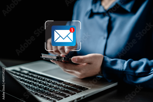 Businesswomen using smartphones check New email notifications and business digital online marketing. Inbox receiving electronic message alert. icon envelope virtual screen, communication technology.