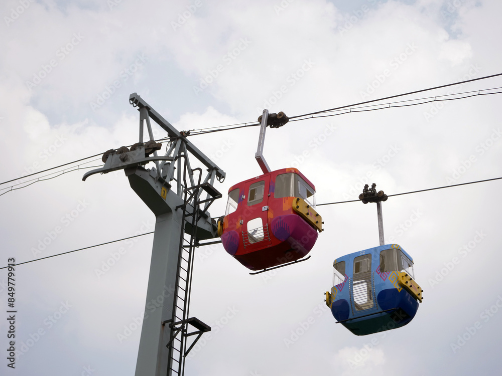 cable car with blue sky background. Cable car in Taman Mini Indonesia Indah cable car with blue sky background. Cable car in Taman Mini Indonesia Indah