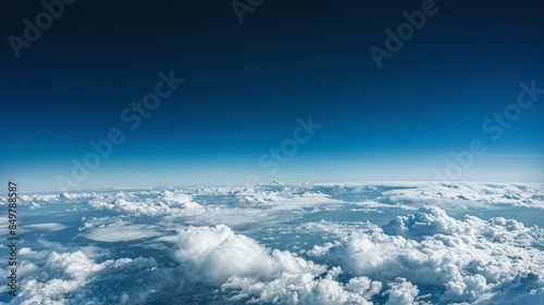 Serene View Above the Clouds with Endless Blue Sky and Horizon Line photo