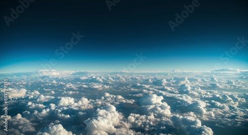 Serene View Above the Clouds with Endless Blue Sky and Horizon Line photo