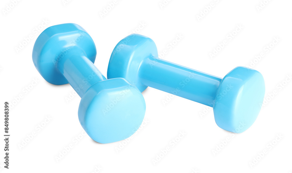 Light blue dumbbells isolated on white. Sports equipment Light blue dumbbells isolated on white. Sports equipment