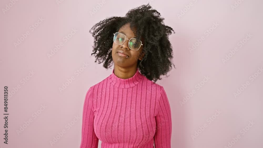 Cheeky african american woman, standing, wearing glasses and flashing 'loser' gesture, hilariously mocking and insulting folks Cheeky african american woman, standing, wearing glasses and flashing 'loser' gesture, hilariously mocking and insulting folks
