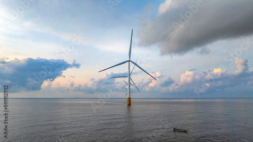 Landscape with Turbine Green Energy Electricity, Windmill for electric power production, Wind turbines generating electricity on ocean at Ba Dong, Tra Vinh, Vietnam. Clean energy concept.