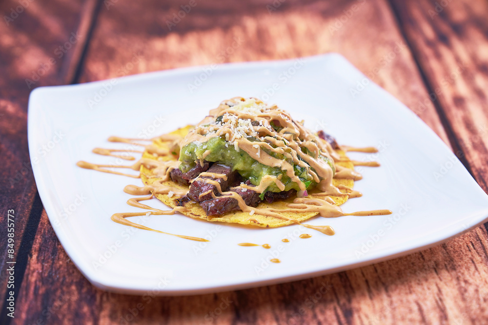Arepas with meat, chiccarron, avocado and variety of sauces Arepas with meat, chiccarron, avocado and variety of sauces