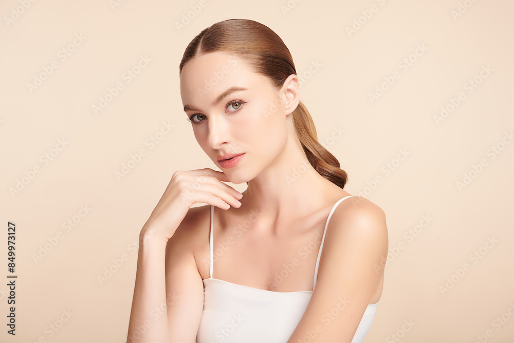 Beautiful young woman with clean fresh skin on beige background, Face care, Facial treatment, Cosmetology, beauty and spa, women portrait. Beautiful young woman with clean fresh skin on beige background, Face care, Facial treatment, Cosmetology, beauty and spa, women portrait.