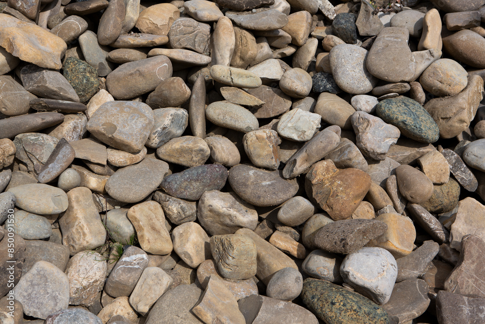 Detailed river rock texture, showcasing smooth, weathered stones and pebbles Detailed river rock texture, showcasing smooth, weathered stones and pebbles