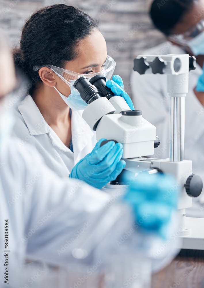 Woman, scientist and research with microscope for investigation and medical innovation with ppe safety in lab. Female person, healthcare expert and virus or bacteria analysis for vaccine development Woman, scientist and research with microscope for investigation and medical innovation with ppe safety in lab. Female person, healthcare expert and virus or bacteria analysis for vaccine development