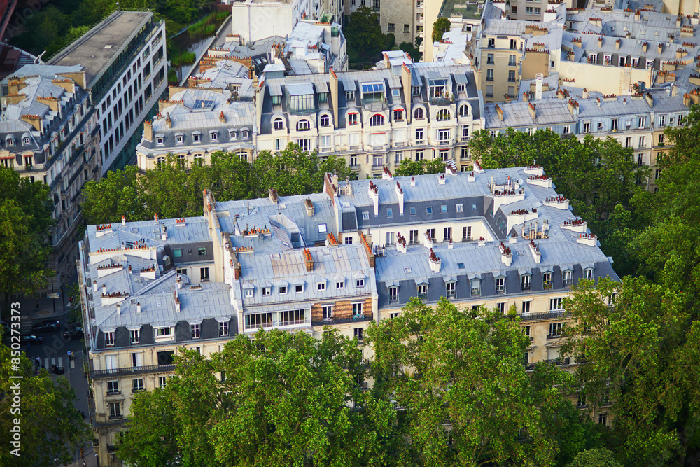 Obraz premium Aerial view of the city roofs in Paris, France.