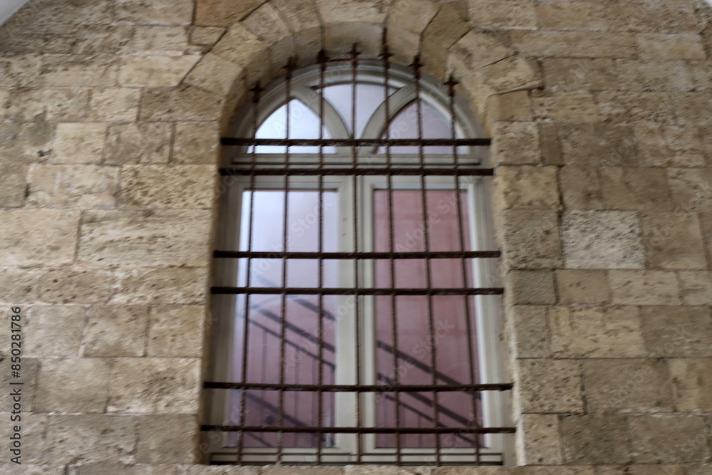 Fototapeta premium A small window as an architectural detail of housing construction in Israel.