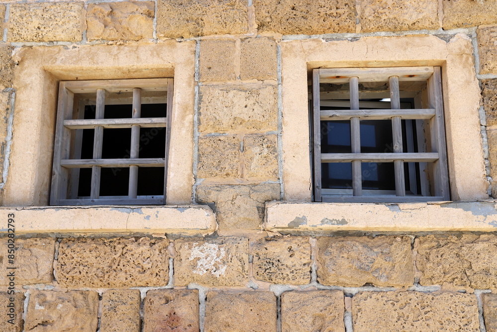 Fototapeta premium A small window as an architectural detail of housing construction in Israel.