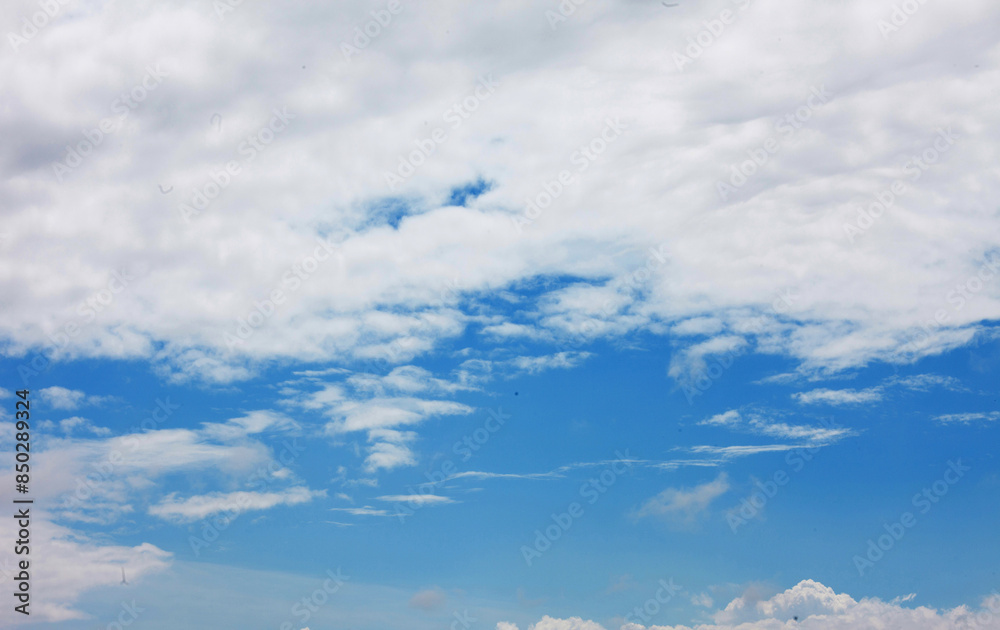 Obraz premium Clouds are the water vapor in the atmosphere that condenses or sublimates in the sky and turns into very small water droplets or ice crystals that float in the air and are visible to our eyes.