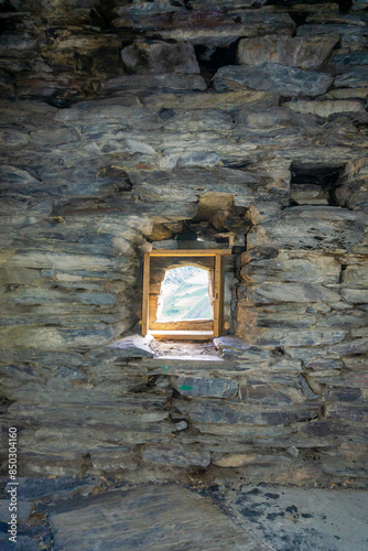 Inside are rooms with stone walls with niches and a small window. Medieval village Mutso. photo