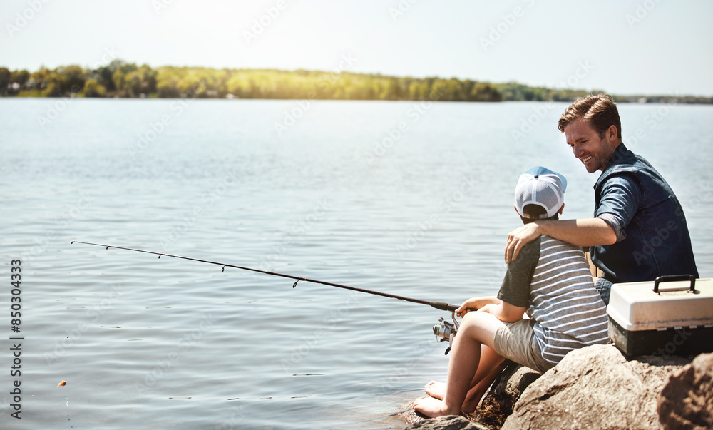 Happy father, fishing and lesson with son on rock with rod by lake, ocean or beach together in nature. Dad with kid, young child or little boy for bonding, teaching or tips to catch by sea water Happy father, fishing and lesson with son on rock with rod by lake, ocean or beach together in nature. Dad with kid, young child or little boy for bonding, teaching or tips to catch by sea water