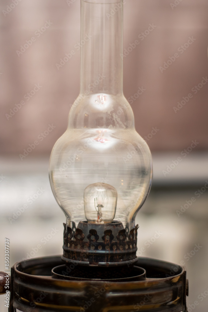 The lantern has a clear glass globe and a handle, perfect for outdoor lighting The lantern has a clear glass globe and a handle, perfect for outdoor lighting