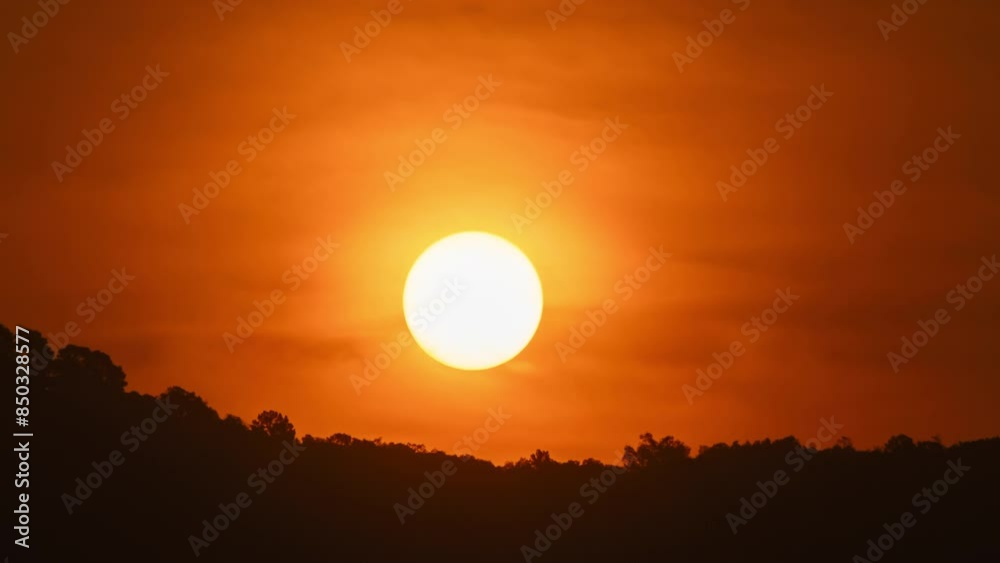 Timelapse of dramatic sunrise with orange sky in a cloudy day. Timelapse of dramatic sunrise with orange sky in a cloudy day.