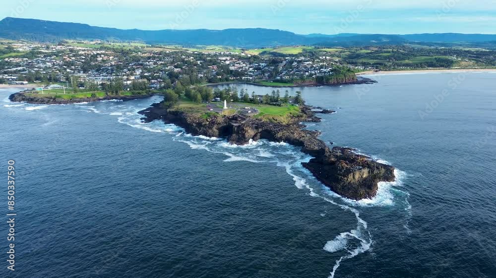 Drone aerial landscape view of lighthouse blowhole of Kiama main town residential neighbourhood suburbs ocean rocky headland coastline South Coast tourism travel Drone aerial landscape view of lighthouse blowhole of Kiama main town residential neighbourhood suburbs ocean rocky headland coastline South Coast tourism travel