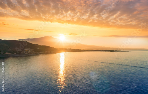 picturesque view to a sunset sea gulf with beautiful mountains and amazing cloudy sky on background of nice travel landscape