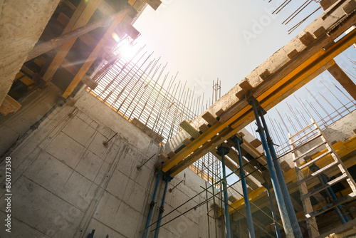 Formwork supports the second floor of a monolithic building. Reinforcement of walls and ceiling. Monolithic work during the construction of a building close-up. construction technologies