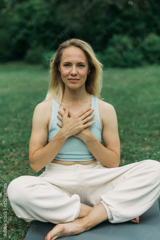 young woman athlete in sportswear practices yoga, enjoys training young woman athlete in sportswear practices yoga, enjoys training