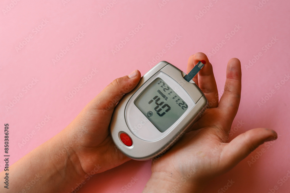 Child measuring blood sugar level Child measuring blood sugar level
