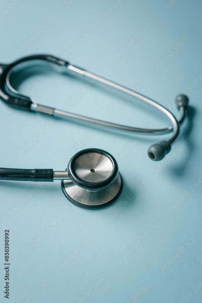 Stethoscope on blue background, top view. Space for text Stethoscope on blue background, top view. Space for text