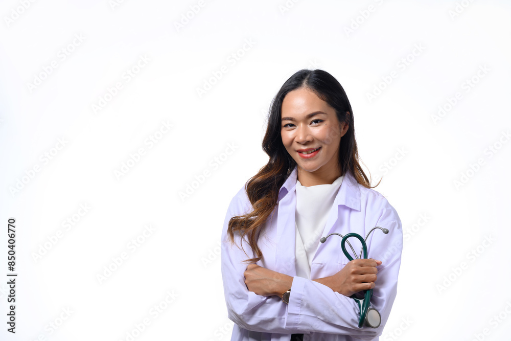 Portrait of female doctor holding stethoscope standing with arms folded isolated on white background Portrait of female doctor holding stethoscope standing with arms folded isolated on white background