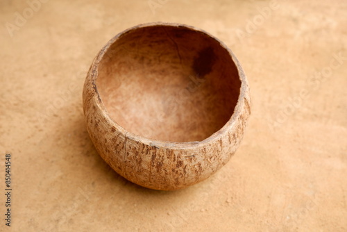 coconut shell halves are placed on the ground.
