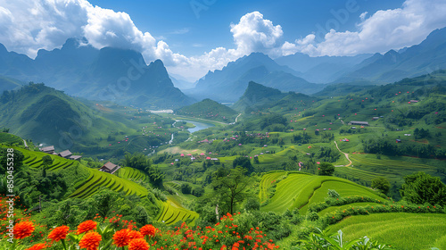 A breathtaking view of lush green terraced rice fields in a mountainous region, with a river winding through the valley. The sky is partly cloudy, and vibrant red flowers are in the foreground.