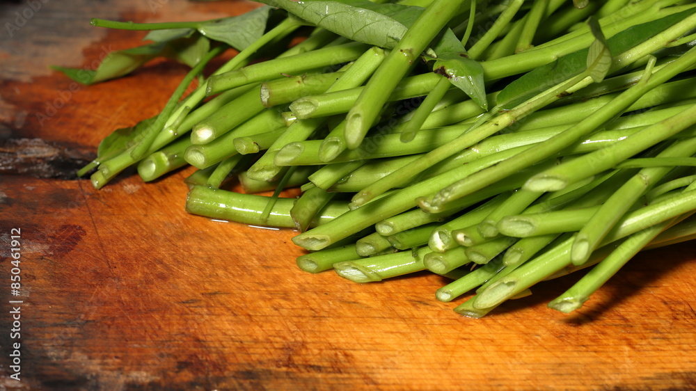 water spinach on wooden background water spinach on wooden background