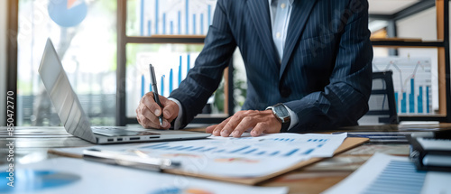 Professional Financial Analyst Analyzing Graphs on PC desk prospective without face, Ultrawide