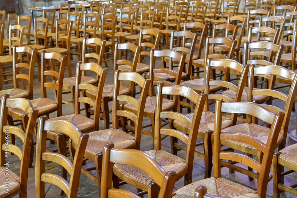 old vintage wooden seats inside a church in France