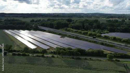 A large open-space photovoltaic system for generating electricity is located directly next to the A20 highway photo