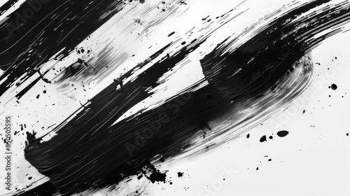 A detailed close-up of thick black paint brushstrokes with splatters emphasizing texture and movement