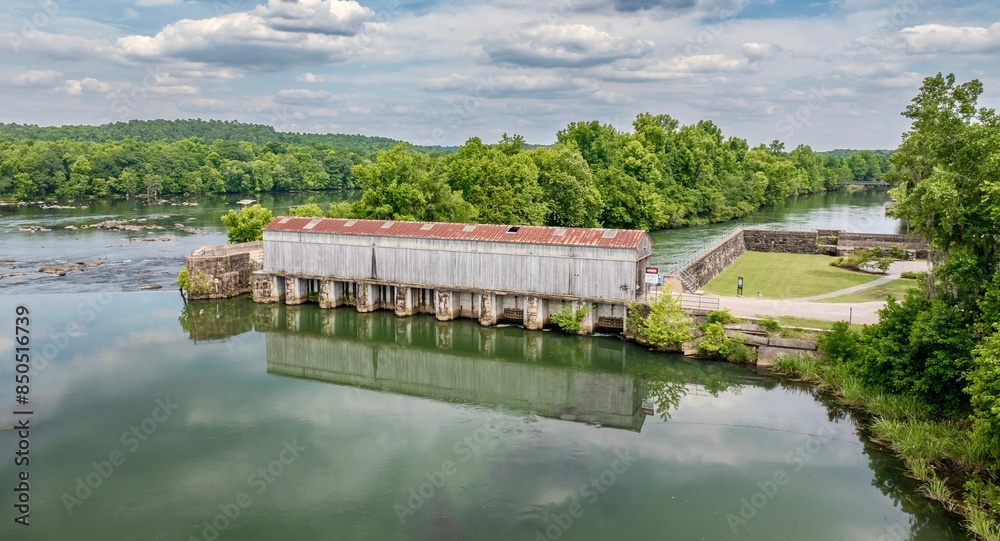 Fototapeta premium Historical dam in Savannah Rapids Park. Georgia, United States