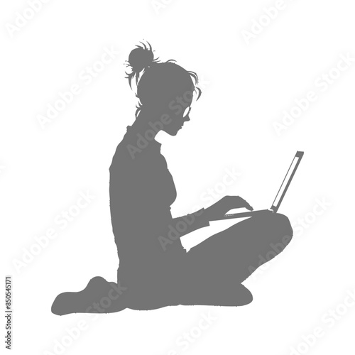 silhouette elderly woman playing on laptop while sitting cross legged