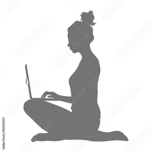 silhouette elderly woman playing on laptop while sitting cross legged