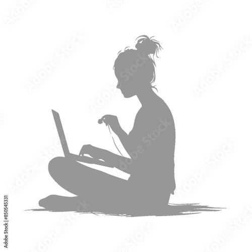 silhouette elderly woman playing on laptop while sitting cross legged