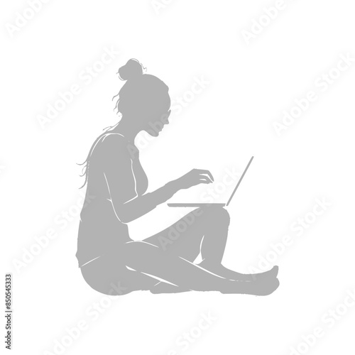 silhouette elderly woman playing on laptop while sitting cross legged