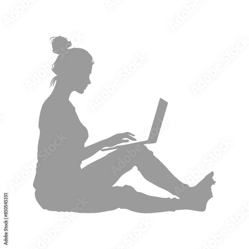 silhouette elderly woman playing on laptop while sitting cross legged